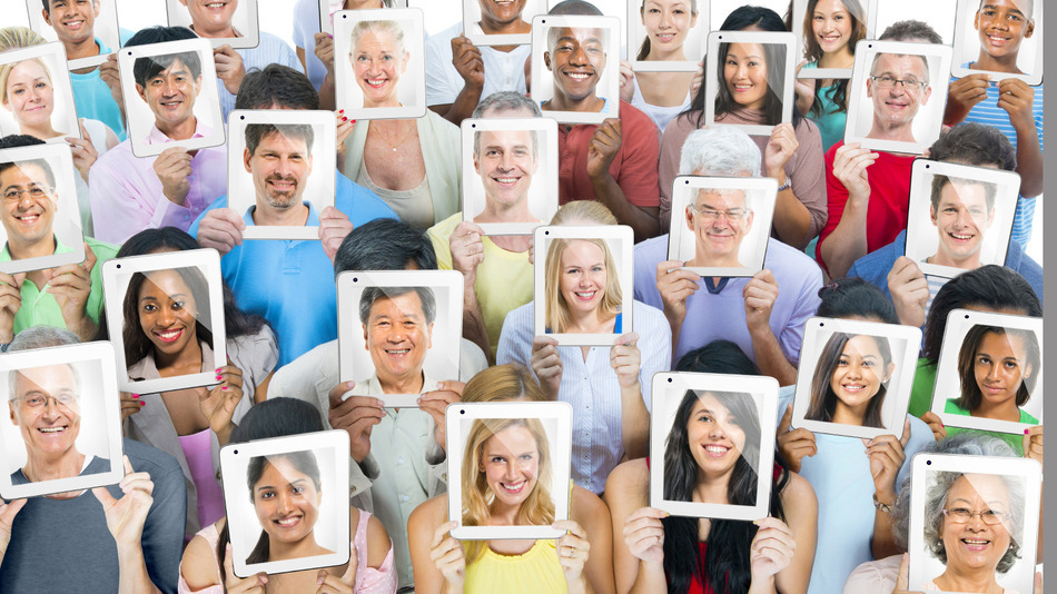 Multi-ethnic casual people holding the tablet