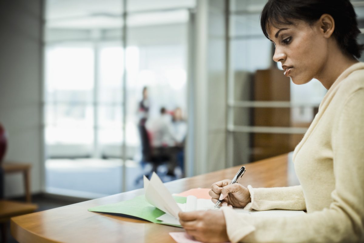 Woman Writing in File