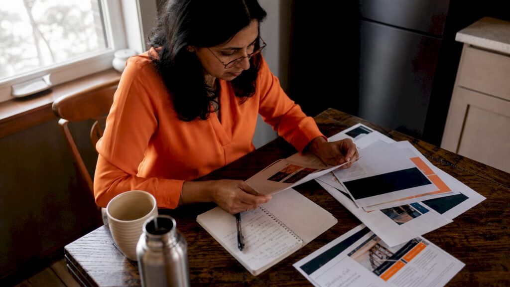 Businesswoman reviewing business phone plan documents
